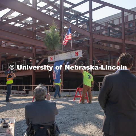 Due to COVID-19 precautions, a public ceremony was not able to be held. Instead, signatures from college and university supporters and others involved in the Phase I project were gathered either remotely or by signing the beam individually. The final beam was installed at the topping off ceremony for Engineering Project, August 26, 2020. Photo by Greg Nathan / University Communication.



